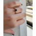 Μονόπετρο δαχτυλίδι από ροζ χρυσό Κ14 με μαύρο και λευκά ζιργκόν